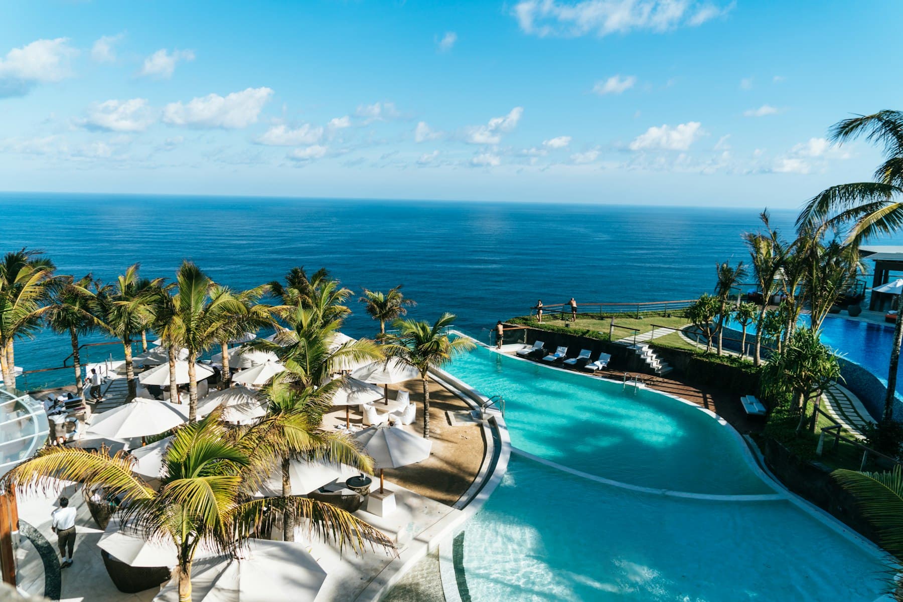 A resort pool overlooking the sea